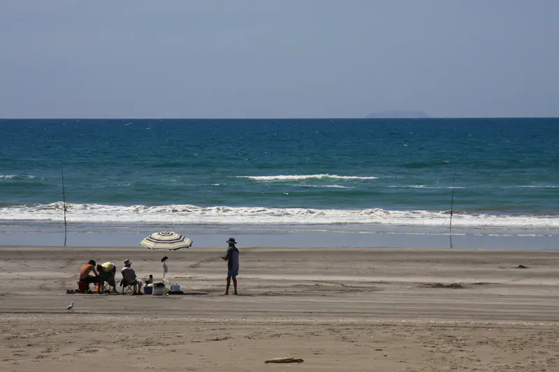 Surfcasting rods set on Waiotahe Beach in New Zealand